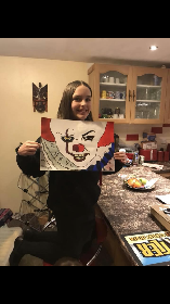 Courtney with her art work Dec 2017.png